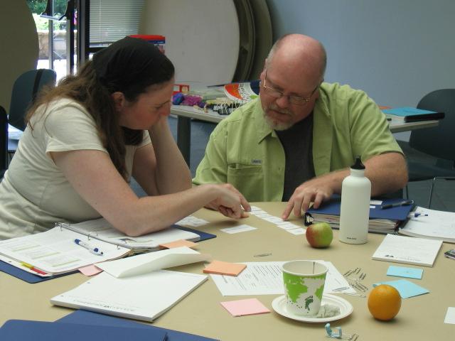 An instructor reviews material with a student